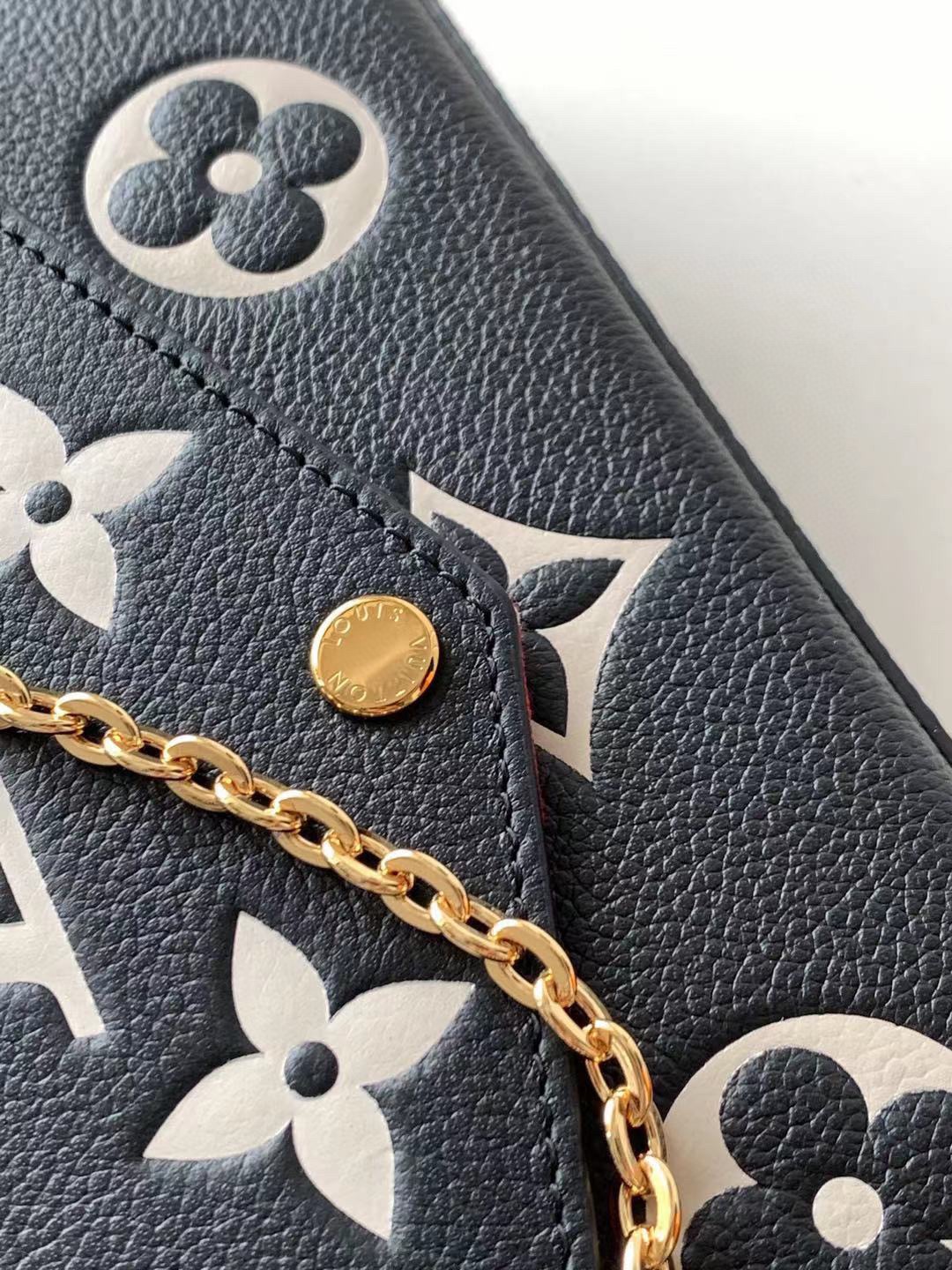 M61276 M64064 M64065 This Pochette F licie chain bag features Monogram Imprente leather depic